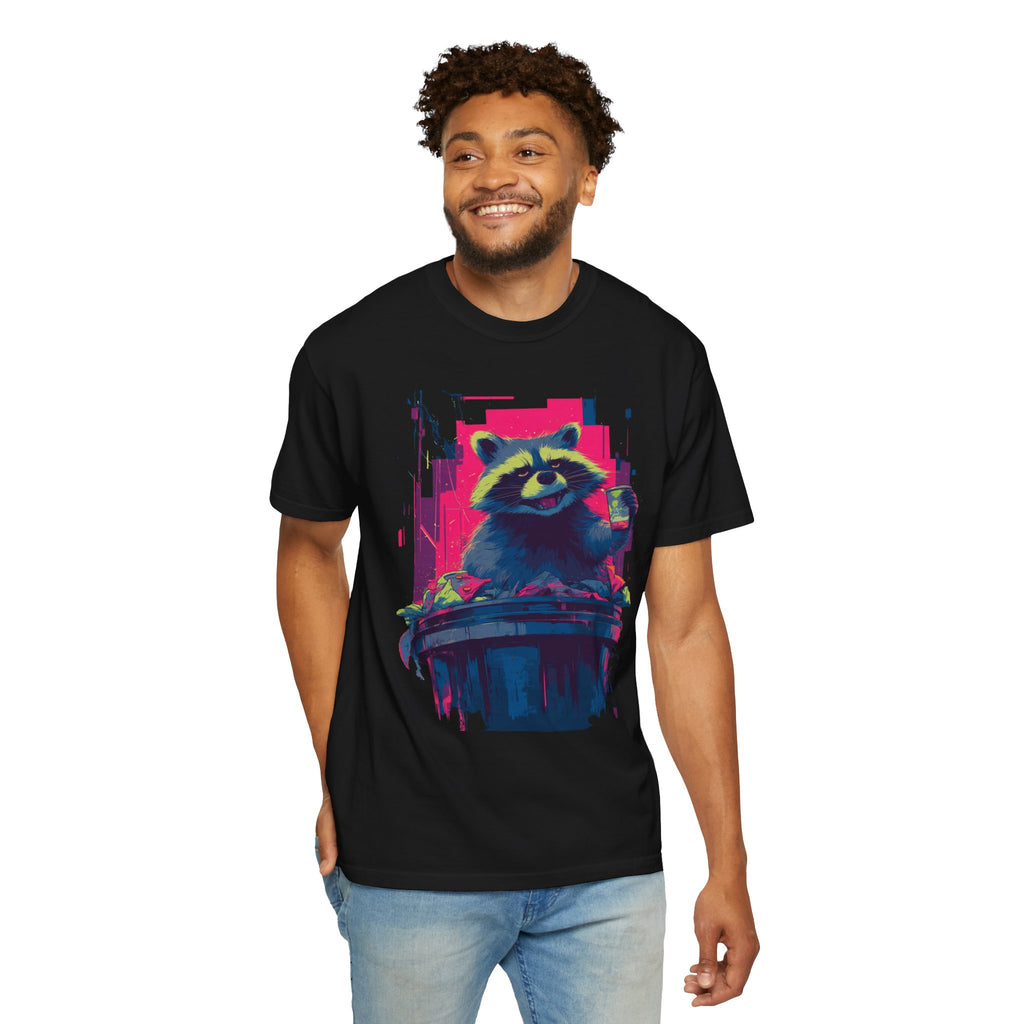​"Black streetwear t-shirt featuring a neon synthwave style graphic of a raccoon in a trash can."
