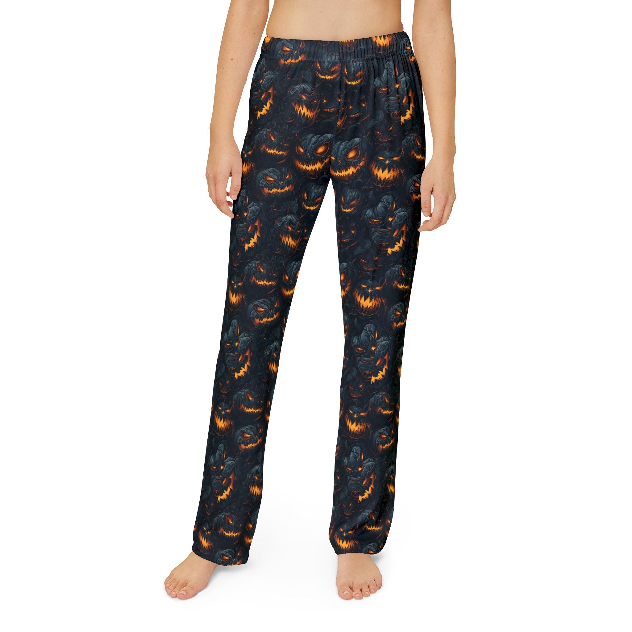 Kids pumpkin print pajama pants worn, front view