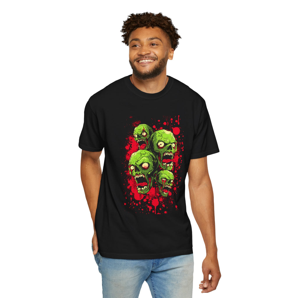 ​"Black unisex streetwear t-shirt featuring a detailed green zombie heads graphic print with red paint splatter effect."