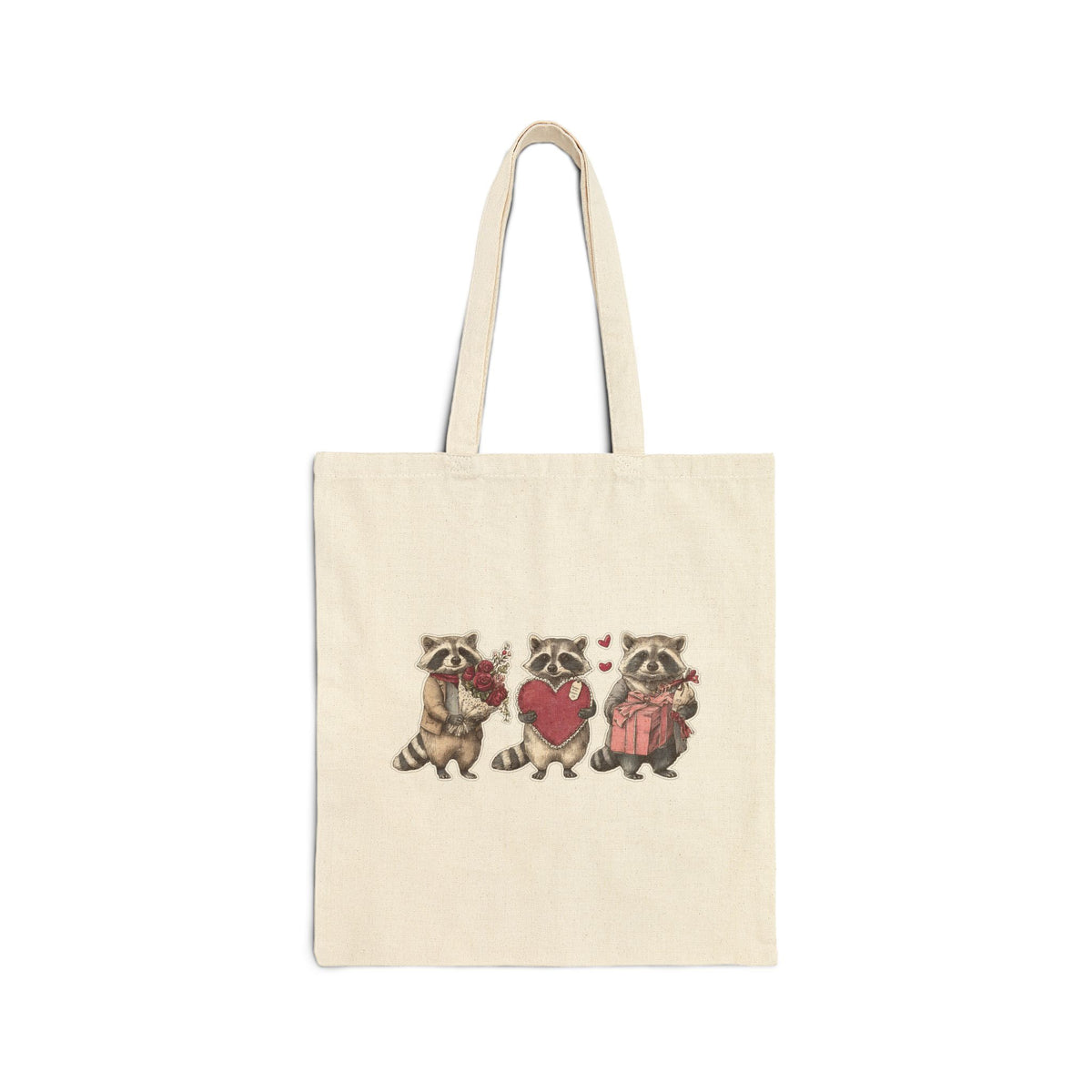 Three raccoons holding heart canvas tote bag, front view