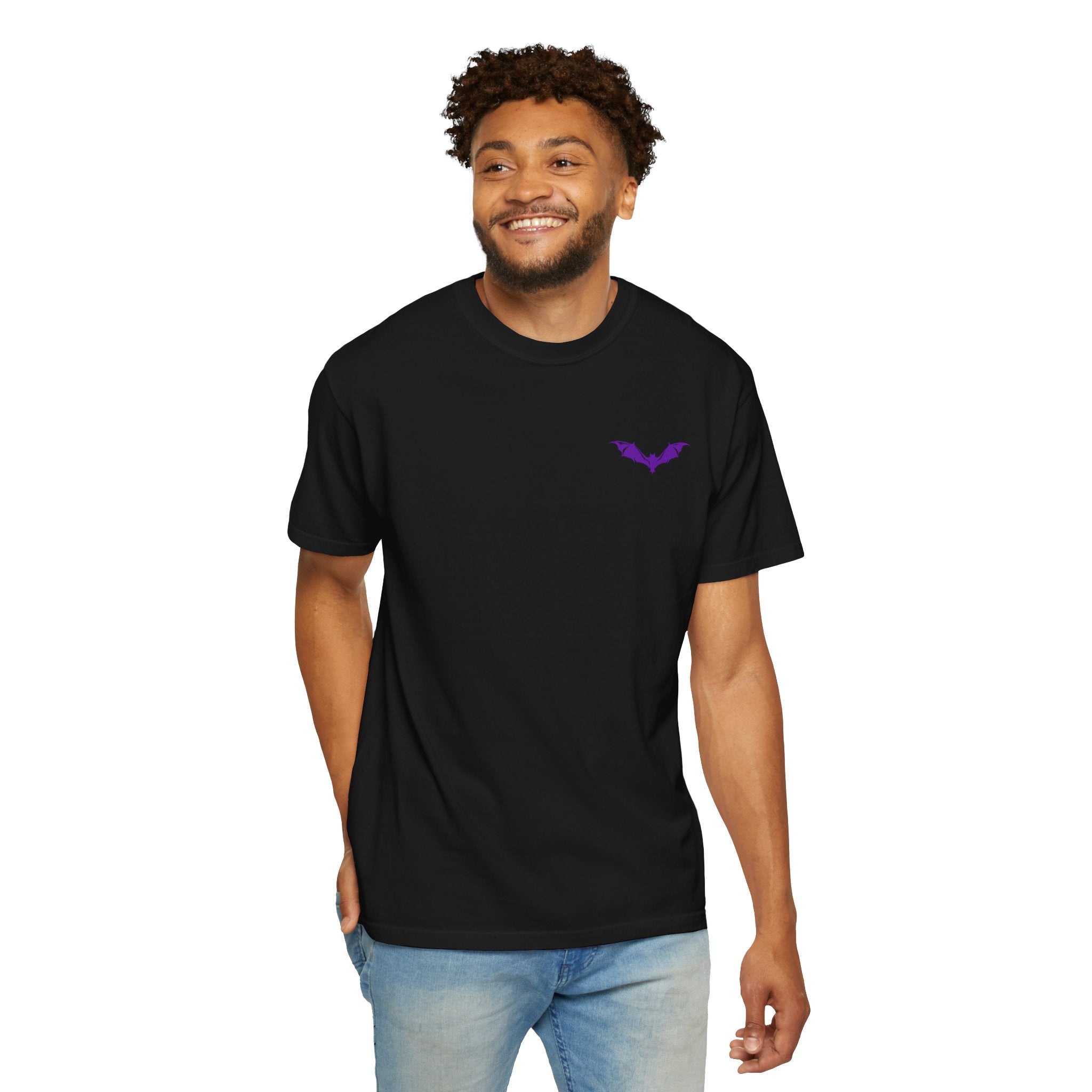 ​"Black minimalist streetwear t-shirt featuring a small purple bat graphic print on the chest."