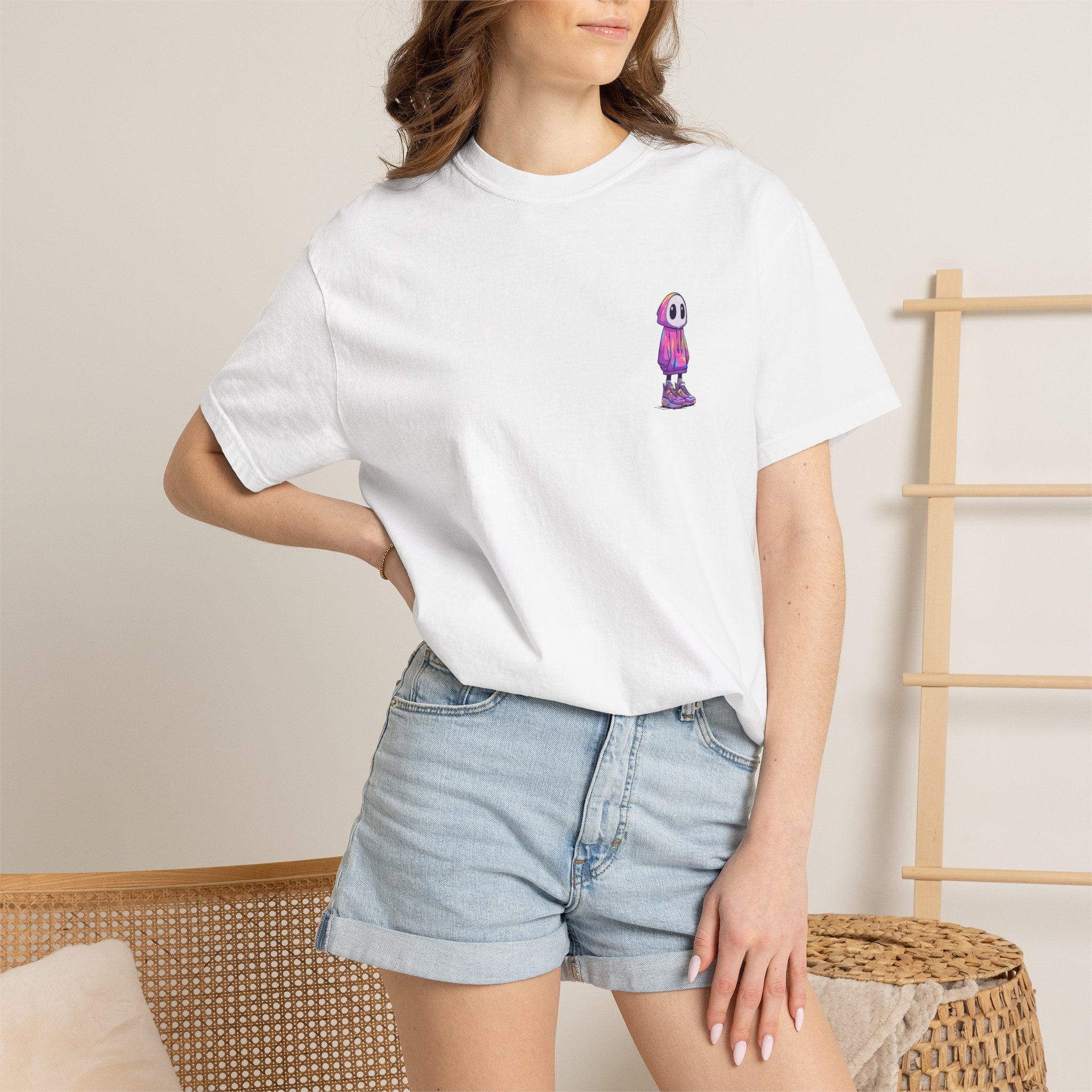 ​"White streetwear t-shirt with a small colorful cyber hooded character graphic print on the chest."